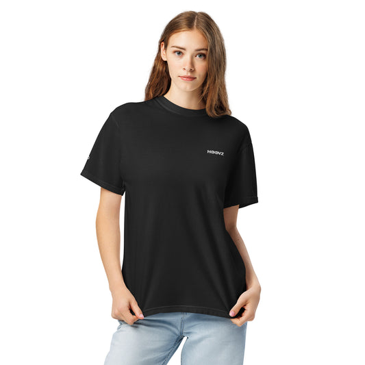 Woman wearing black heavyweight HOOVZ t-shirt front view, clean minimal streetwear style