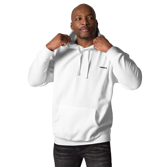 Man wearing white HOOVZ premium hoodie front view, minimal streetwear outfit